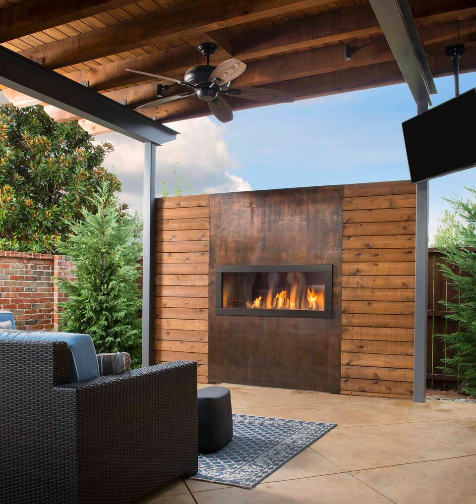 Contemporary outdoor fireplace and seating area