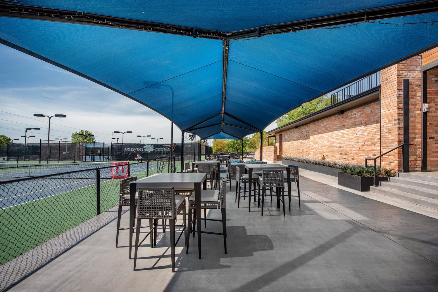 outdoor living area with gabled patio cover
